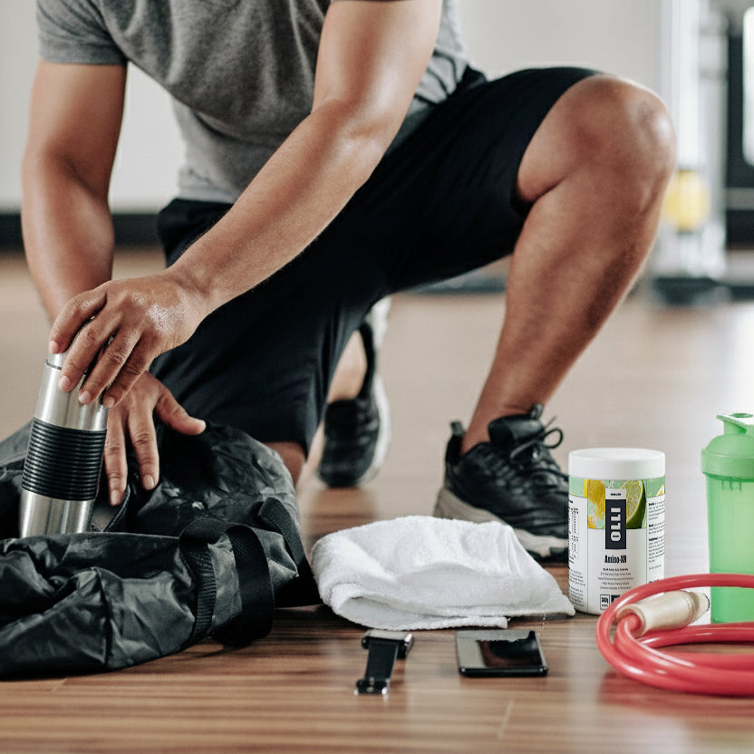 Athlete drinking Amino-XR intra-workout BCAA supplement to reduce fatigue and support muscle recovery