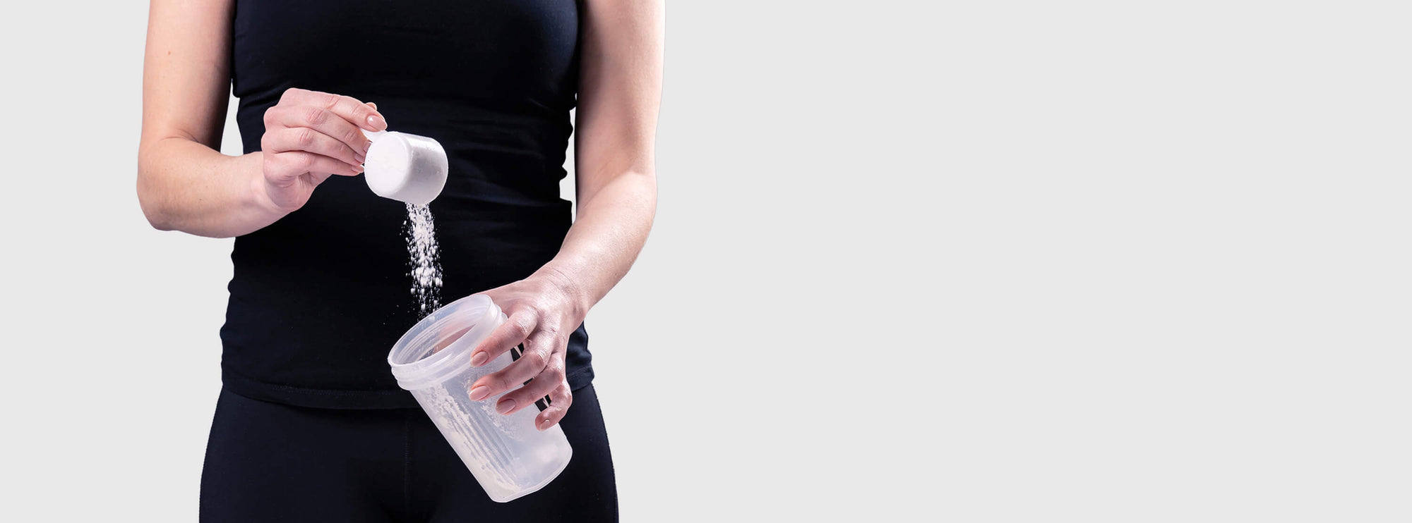 Amino-XR intra-workout BCAA supplement supporting muscle endurance and hydration being poured into a shaker